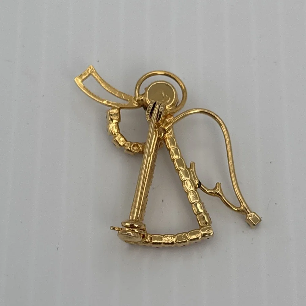 Vintage Rhinestone Angel with Trumpet Gold Tone Brooch Pin Red Clear Green